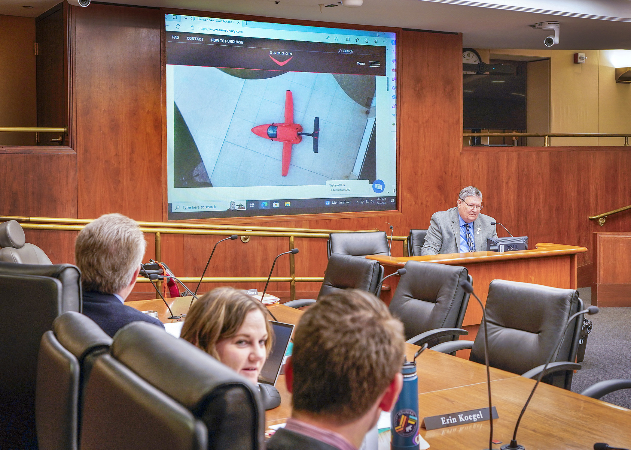 Rep. John Petersburg plays a promotional video for a flying car manufacturer during his presentation to the House transportation committee of a bill that would establish roadable aircraft registration and operation requirements. (Photo by Andrew VonBank)